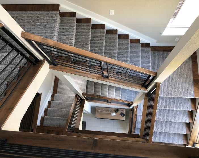 Gray stair runner on a spiral staircase